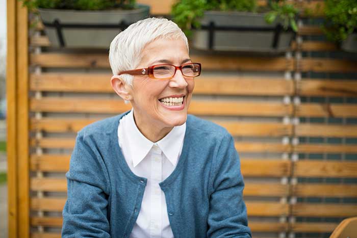 A senior woman smiling